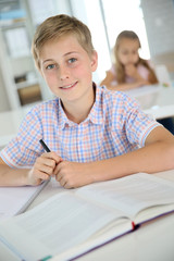 Portrait of 12-year-old boy in classroom