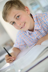 Portrait of 12-year-old boy in classroom