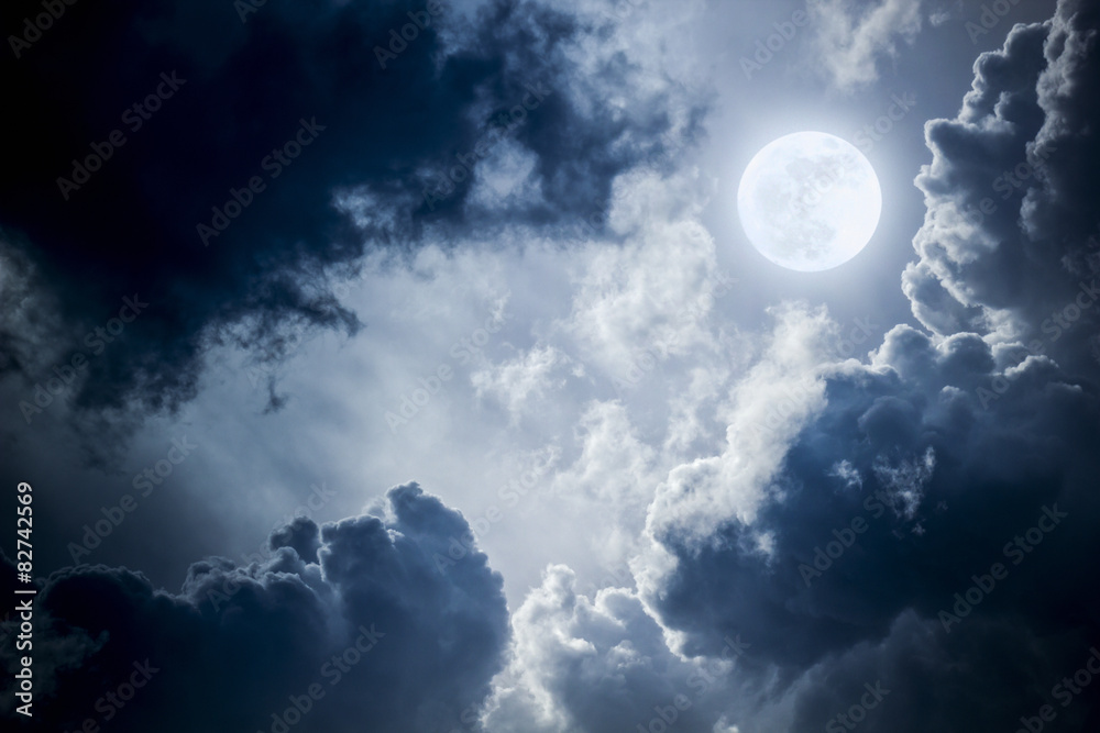 Wall mural dramatic nighttime clouds and sky with beautiful full blue moon