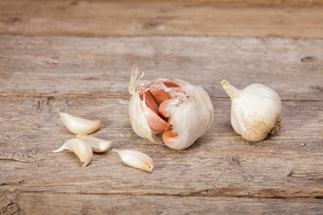 Organic garlic on rustic old wooden table