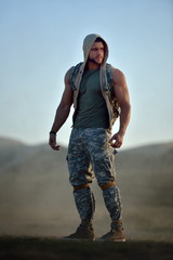 athletic young man on dusty field