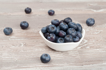 white bowl of fresh blueberries