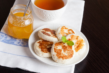 Pancakes, decorated mint, honey and tea