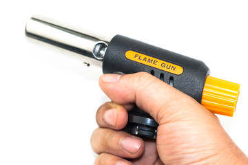 hand holding gas cooking flame gun isolated