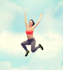 Fototapeta na wymiar sporty teenage girl jumping in sportswear