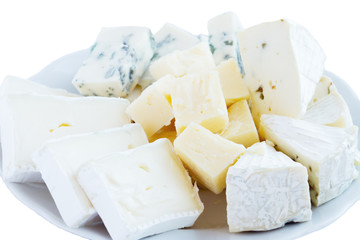 Different varieties of cheese with honey and nuts