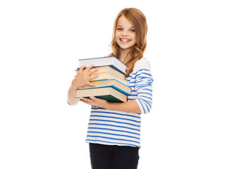 little student girl with many books