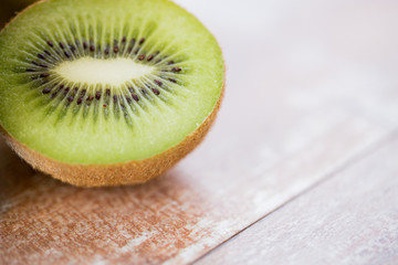 close up of ripe kiwi slice on table