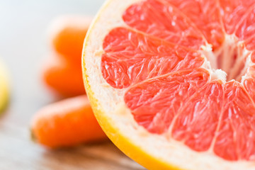 close up of fresh juicy grapefruit slice on table
