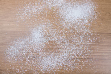 Flour on a light wooden table