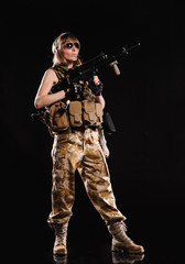 Beautiful army girl with gun