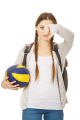 Young woman with volley ball.