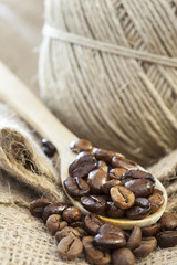 coffee beans in wooden spoon