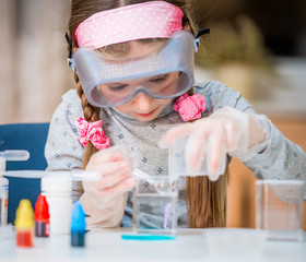 girl with flasks for chemistry