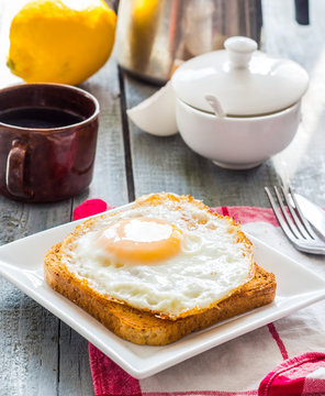 crispy toast with a fried egg and a cup of coffee. English break