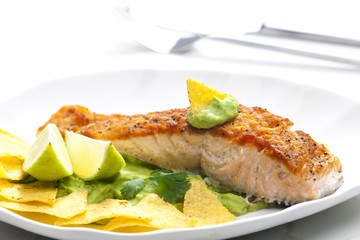 grilled salmon fillet with avocado sauce and nachos