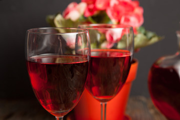  glass with red wine and flower