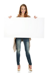 Happy woman with blank board.