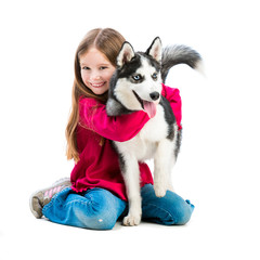 little girl is with husky dog 