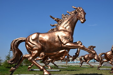 Bronze sculpture featuring a racing horse, in Astana, Kazakhstan