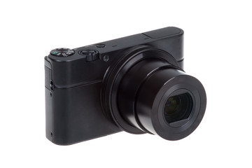 Fototapeta premium Digital compact camera with open lens isolated on white