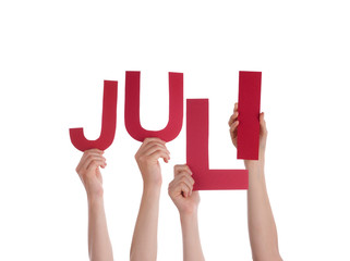 People Holding German Word Juli Means July