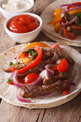 Mexican food: tacos with meat and vegetables close-up