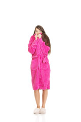 Beautiful woman in pink bathrobe.