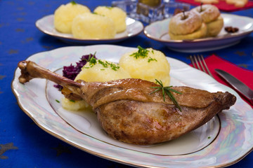 Crusty goose leg with braised red cabbage and dumplings