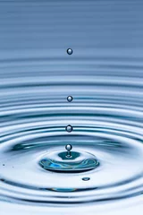 Fotobehang Drop of water falling into water surface © Jag_cz