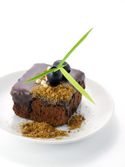 chocolate cake with Black olives on white isolated background