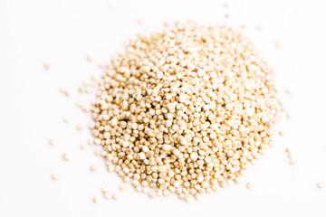Fototapeta na wymiar Pile of quinoa grain on a white background