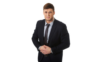 Businessman suffering from stomach pain.