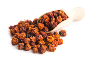 Dried rowan berries on a white background