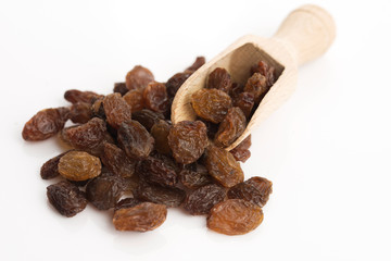 Dried raisins on a white background