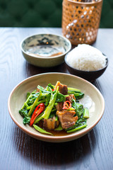 Thai foods. Crispy pork belly with Chinese brocoli