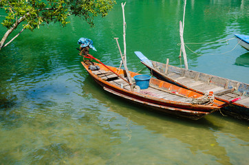 Obraz premium Fisherman Wood Boats Parking In Clear Water.
