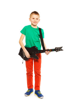 View Of Boy Playing On Electro Guitar Standing