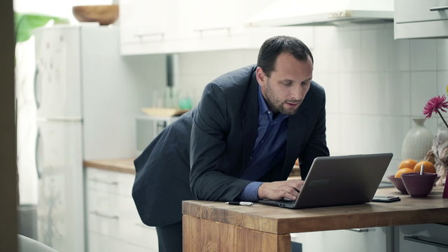 Young businessman working on laptop 
