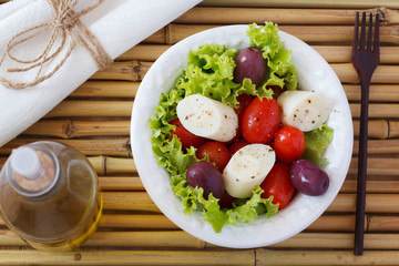 Salad of heart of palm (palmito), cherry tomatos, olives, pepper