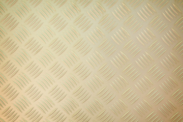 A background of old metal diamond plate.