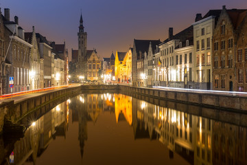 Fototapeta na wymiar Historic medieval buildings in Bruges, Belgium at night.