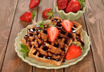 Waffles with topping and strawberries