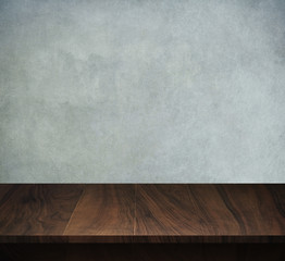 Wood table with loft concrete background