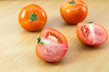 fresh Tomatoes on a woodden  background