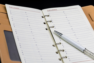 Personal organizer address book and pen
