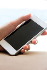 Woman hand holding a Smart Phone