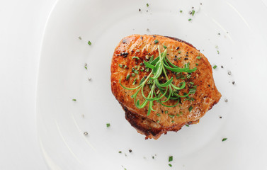 Steak with rosemary on a plate