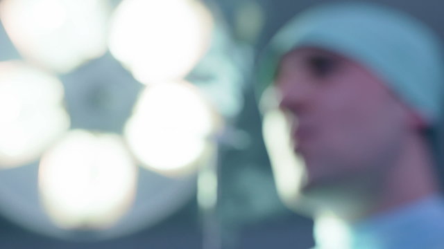 Defocused Shot of Doctor Smoking in Operating Room