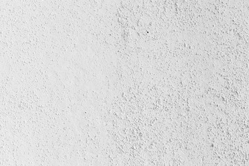 White concrete wall with relief plaster pattern
